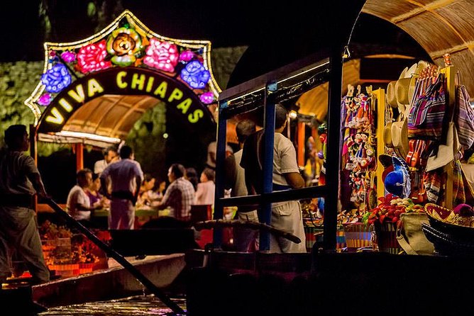 Xoximilco Night Cruise With Round Transportation from Tulum City - Boarding the colorful trajinera at Xoximilco Cancun by Xcaret